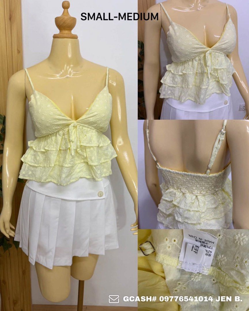 Yellow Eyelet Ruffle Cami Top Small Medium (Category: Sleeveless) located in Tagum. Submitted by bernardino49694 (Listing ID 1465010196, Image 1). Description: - Color: Pastel yellow - Features: Eyelet embroidery, front tie detail, and layered ruffles - Fit: Smocked elastic back panel and adjustable spaghetti straps for comfort (Fits Small to Medium) - Origin: Made in China with fabric blend tag attached.