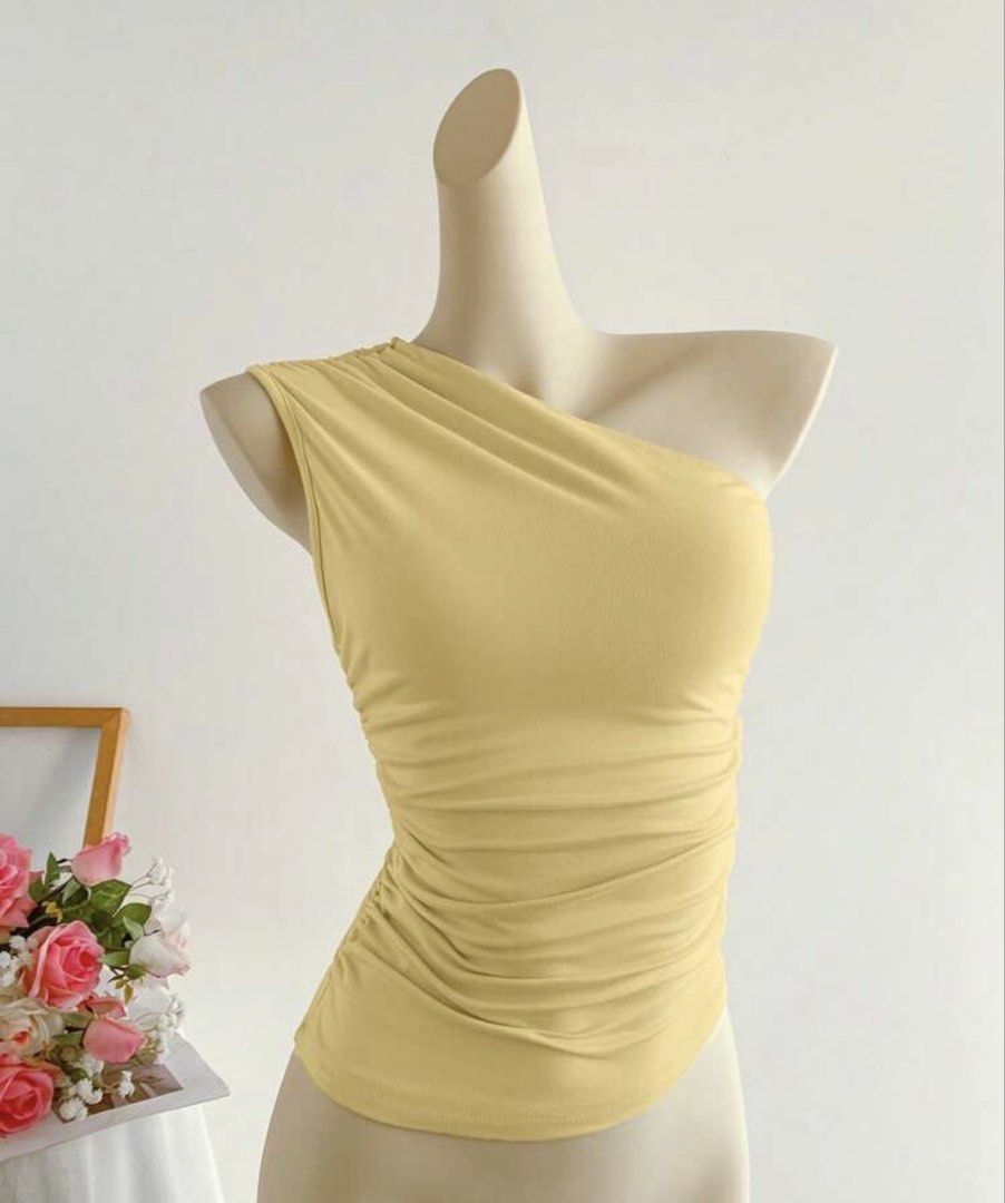 Yellow One sided shoulder top (Category: Sleeveless) located in Manila. Submitted by okaykloset (Listing ID 1464996837, Image 2). Description: Rfs: decluttering Free size but best fit for s-m Has zipper on the side MOP: gcash/gotyme MOD: lalamove (sdd)/jnt.