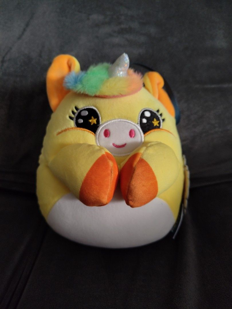 Yellow Unicorn Plush Toy with Rainbow Mane (Category: Plushies & Soft Toys) located in Manila. Submitted by youngcrystal_063c61 (Listing ID 1465019951, Image 1). Description: - Bright yellow unicorn stuffed animal - Soft and fluffy rainbow mane with a sparkly silver horn - Large sparkly eyes featuring cute star details - Orange inner ears and hooves with a contrasting white belly - Brand new with the original tag still attached - Perfect for gift