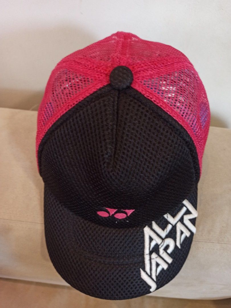 Yonex All Japan Mesh Trucker Hat (Category: Caps & Hats) located in Caloocan City. Submitted by rtarellano (Listing ID 1464994424, Image 2). Description: - Authentic Yonex trucker hat imported from Japan - Black front panel with striking white 'All Japan' lettering and pink Yonex logo - Vibrant pink mesh back for breathability - Adjustable strap closure for a customized fit - Free size (fits most head sizes) - Ideal for badminton players, athlete