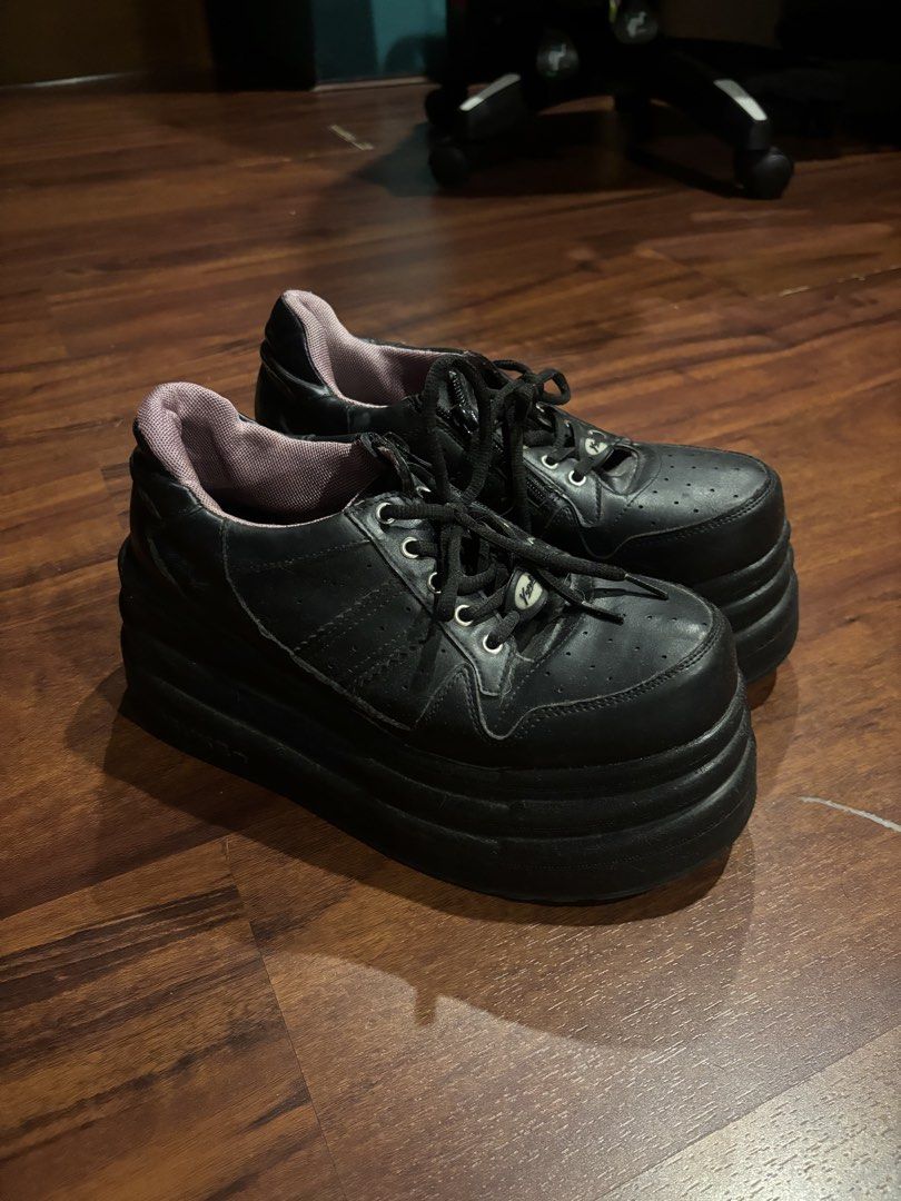 Yosuke Chunky Platform Sneakers Black (Category: Sneakers) located in Quezon City. Submitted by closetskey (Listing ID 1465144828, Image 1). Description: - Brand/Model: Yosuke platform sneakers - Color: Solid black with a pop of purple inner lining - Design: Chunky silhouette with a heavy, thick platform sole for extra height and laced front - Condition: Minor creasing on the leather upper from normal wear, sturdy build - Style: Great for alt, gr