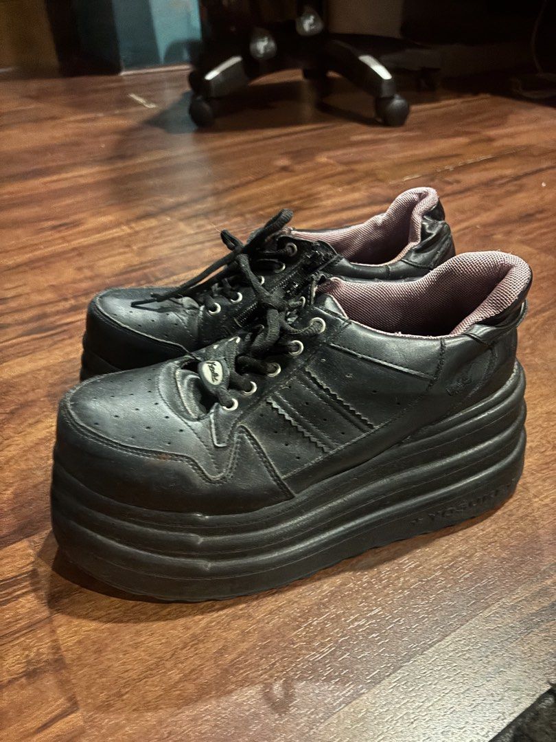 Yosuke Chunky Platform Sneakers Black (Category: Sneakers) located in Quezon City. Submitted by closetskey (Listing ID 1465144828, Image 2). Description: - Brand/Model: Yosuke platform sneakers - Color: Solid black with a pop of purple inner lining - Design: Chunky silhouette with a heavy, thick platform sole for extra height and laced front - Condition: Minor creasing on the leather upper from normal wear, sturdy build - Style: Great for alt, gr
