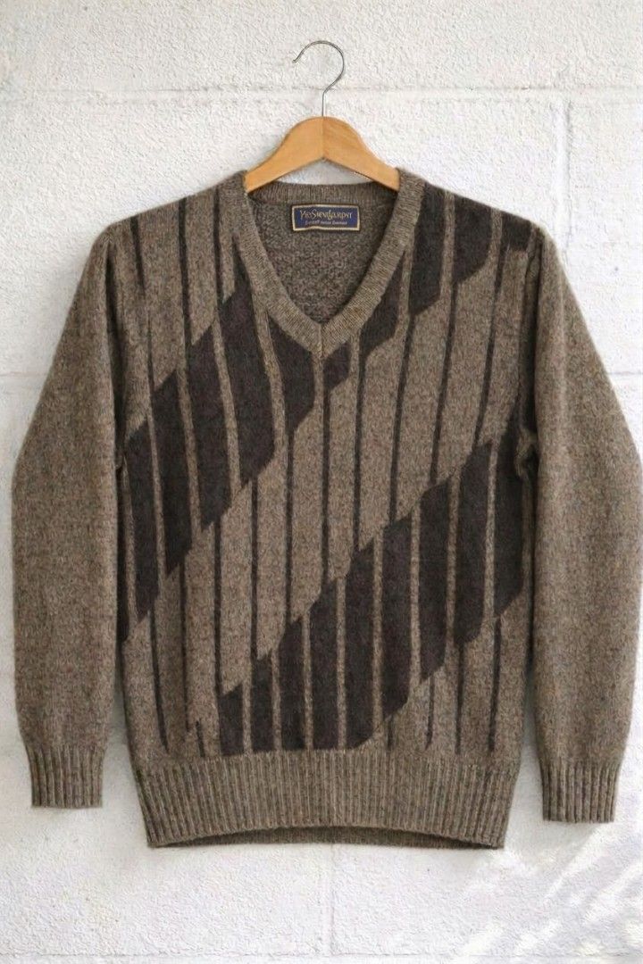 Yves Saint Lauren vneck sweater (Category: Coats, Jackets and Outerwear) located in Baguio. Submitted by luxeloomarchive (Listing ID 1465103207, Image 2). Description: This vintage Yves Saint Laurent (YSL) v-neck sweater features a unique brown diagonal geometric pattern with dark brown vertical stripes and a classic ribbed hem and cuffs. It includes the authentic YSL designer neck tag. A stylish addition to any pre-owned or designer collection. 