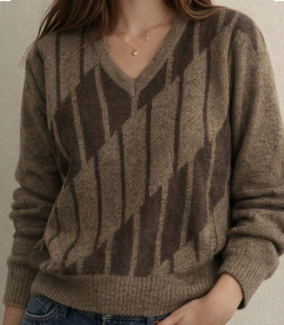 Yves Saint Lauren vneck sweater (Category: Coats, Jackets and Outerwear) located in Baguio. Submitted by luxeloomarchive (Listing ID 1465103207, Image 1). Description: This vintage Yves Saint Laurent (YSL) v-neck sweater features a unique brown diagonal geometric pattern with dark brown vertical stripes and a classic ribbed hem and cuffs. It includes the authentic YSL designer neck tag. A stylish addition to any pre-owned or designer collection. 