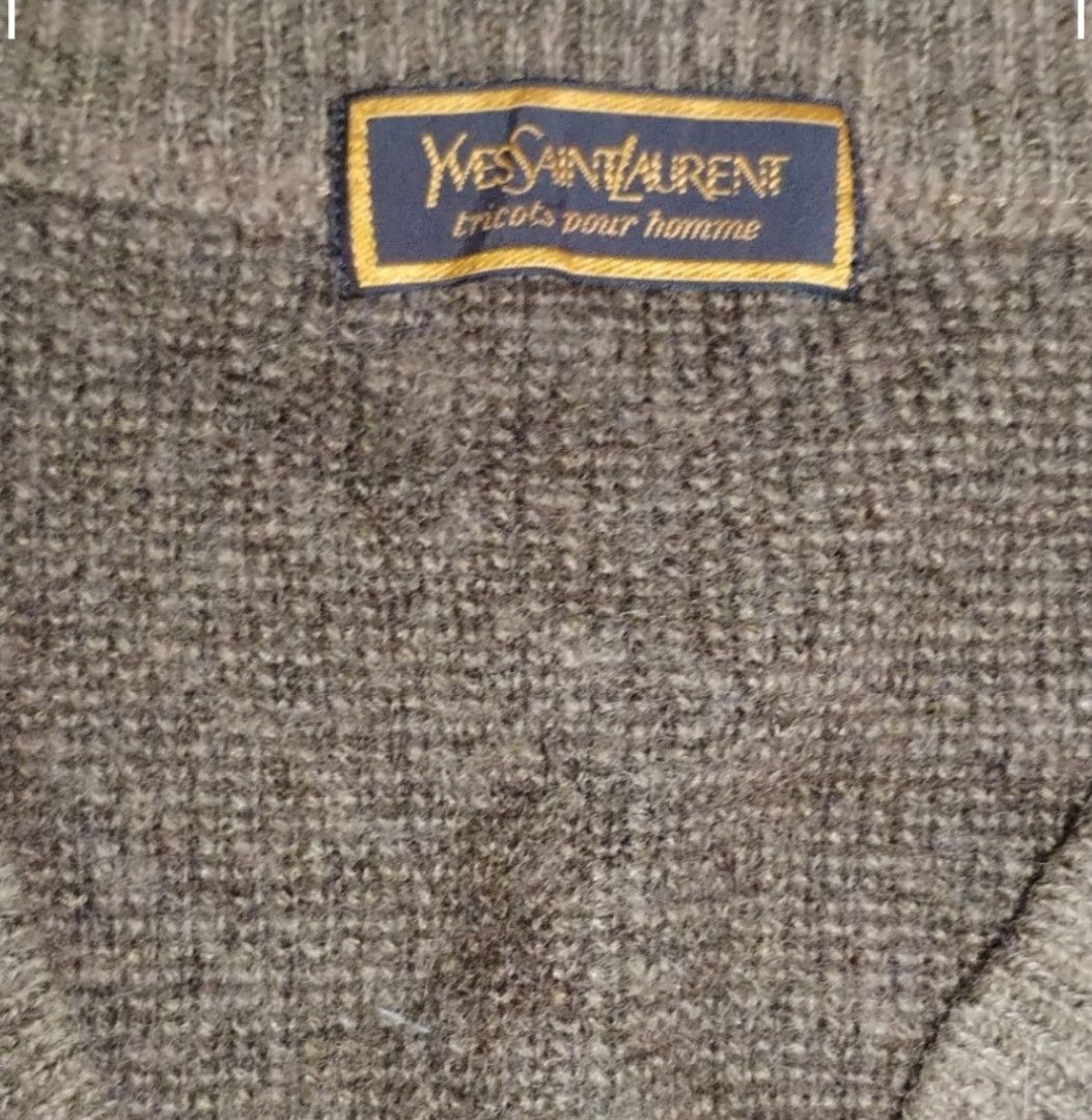 Yves Saint Lauren vneck sweater (Category: Coats, Jackets and Outerwear) located in Baguio. Submitted by luxeloomarchive (Listing ID 1465103207, Image 3). Description: This vintage Yves Saint Laurent (YSL) v-neck sweater features a unique brown diagonal geometric pattern with dark brown vertical stripes and a classic ribbed hem and cuffs. It includes the authentic YSL designer neck tag. A stylish addition to any pre-owned or designer collection. 