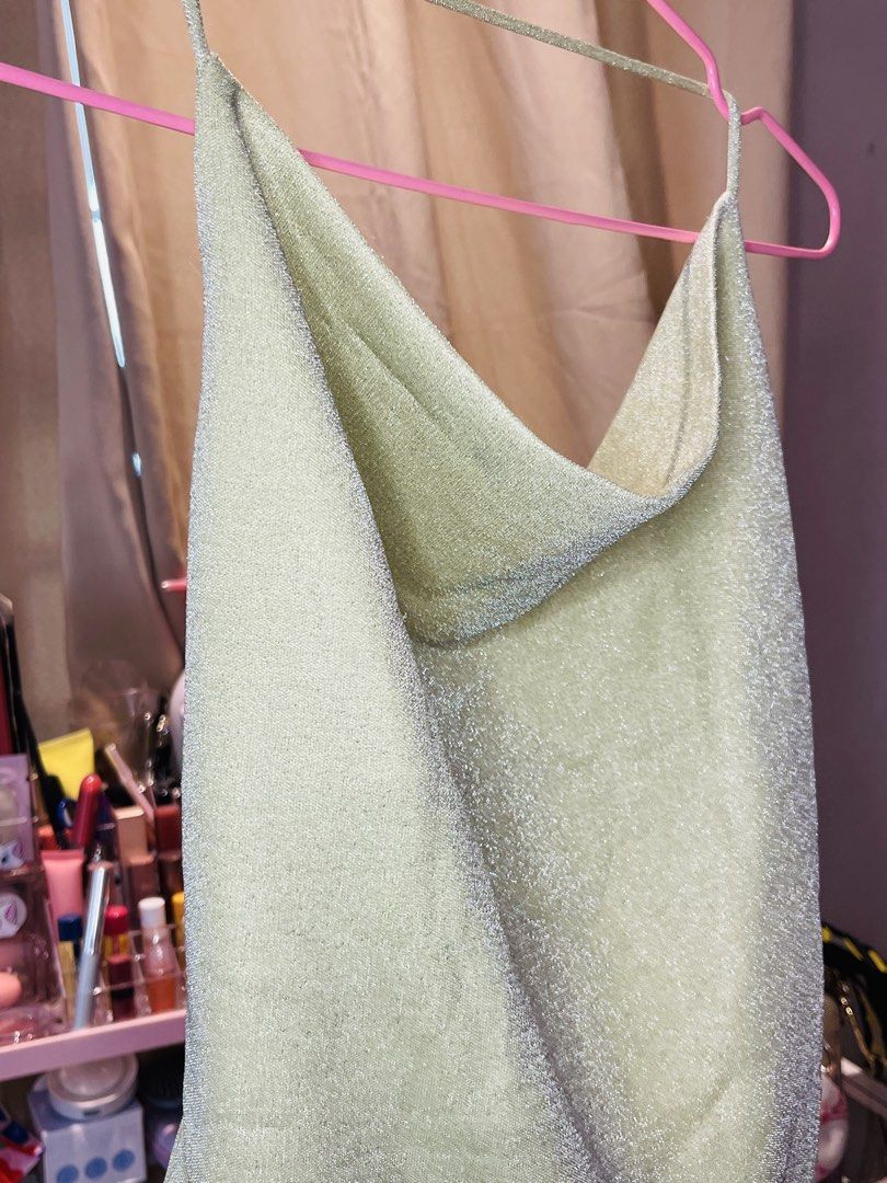 Zalora Studios Metallic Green Cowl Neck Top Size M (Category: Sleeveless) located in San Mateo. Submitted by precious.03 (Listing ID 1464997794, Image 3). Description: - Brand: Zalora Studios - Size: M - Color: Sparkly green with metallic shimmer - Design: Cowl neckline, spaghetti straps, and open back detail - Perfect for: Parties, dates, and night outs - Styling tip: Easy to pair with high-waisted jeans or skirts.