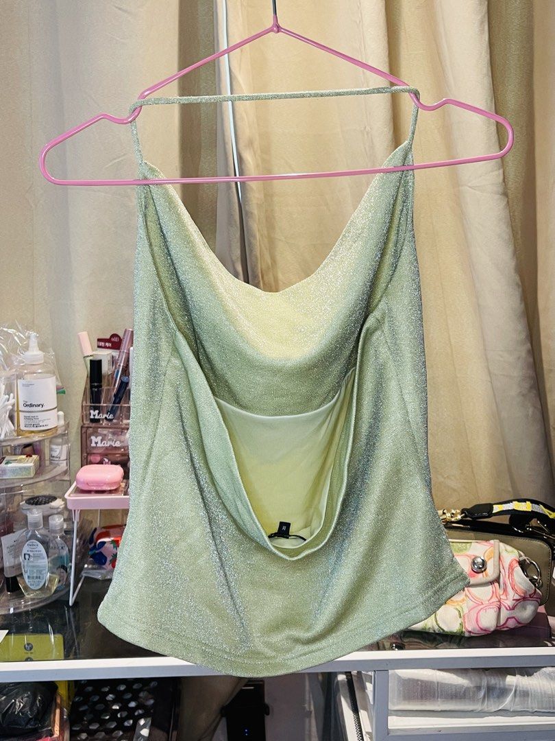 Zalora Studios Metallic Green Cowl Neck Top Size M (Category: Sleeveless) located in San Mateo. Submitted by precious.03 (Listing ID 1464997794, Image 2). Description: - Brand: Zalora Studios - Size: M - Color: Sparkly green with metallic shimmer - Design: Cowl neckline, spaghetti straps, and open back detail - Perfect for: Parties, dates, and night outs - Styling tip: Easy to pair with high-waisted jeans or skirts.