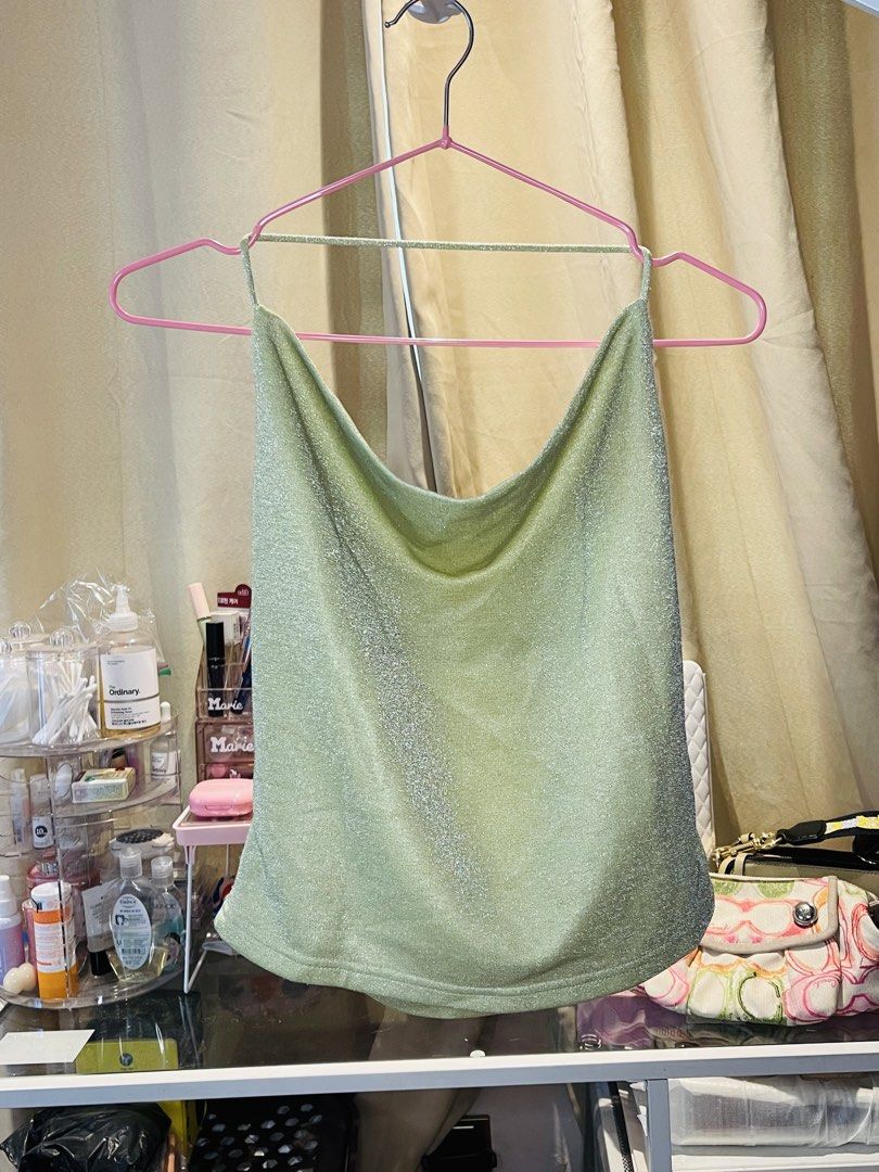 Zalora Studios Metallic Green Cowl Neck Top Size M (Category: Sleeveless) located in San Mateo. Submitted by precious.03 (Listing ID 1464997794, Image 1). Description: - Brand: Zalora Studios - Size: M - Color: Sparkly green with metallic shimmer - Design: Cowl neckline, spaghetti straps, and open back detail - Perfect for: Parties, dates, and night outs - Styling tip: Easy to pair with high-waisted jeans or skirts.