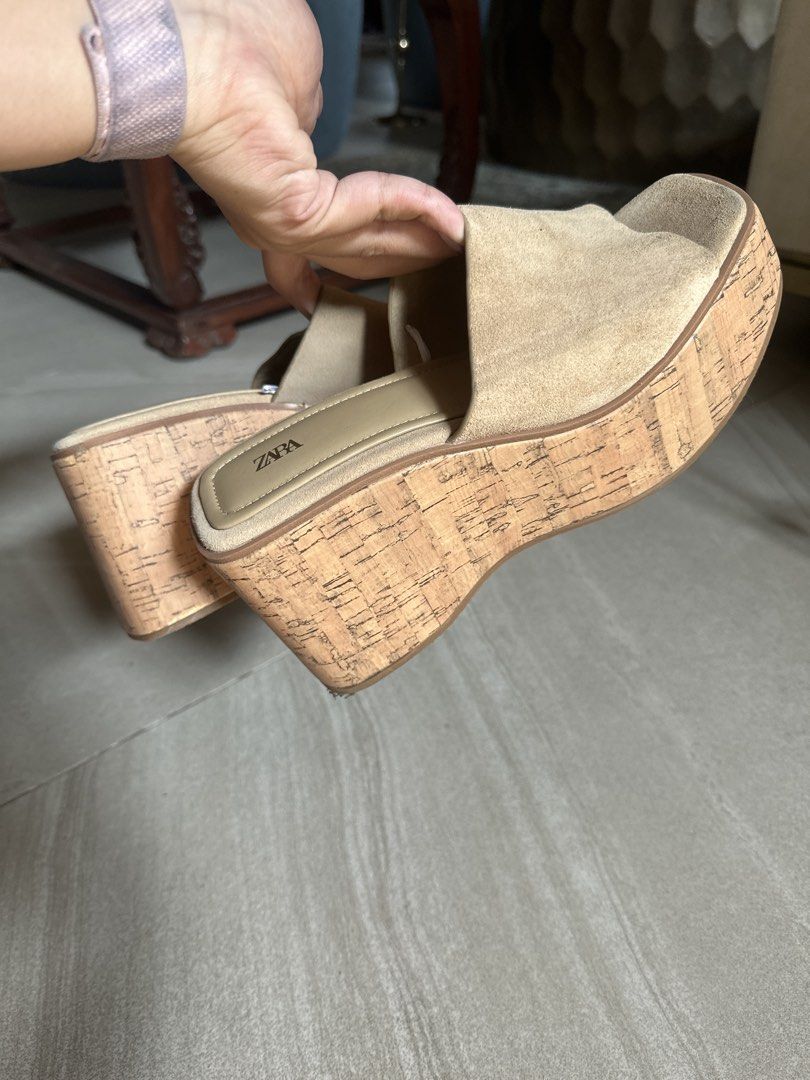 Zara Beige Suede Cork Wedge Sandals (Category: Wedges) located in Muntinlupa City. Submitted by stuffbya (Listing ID 1464972442, Image 3). Description: - Brand: Zara - Style: Platform sandals with chunky cork wedges - Material: Wide suede toe straps - Design: Easy slip-on style - Color: Versatile neutral beige - Features: Good heel height, stable to walk in, clean insoles with clear branding.