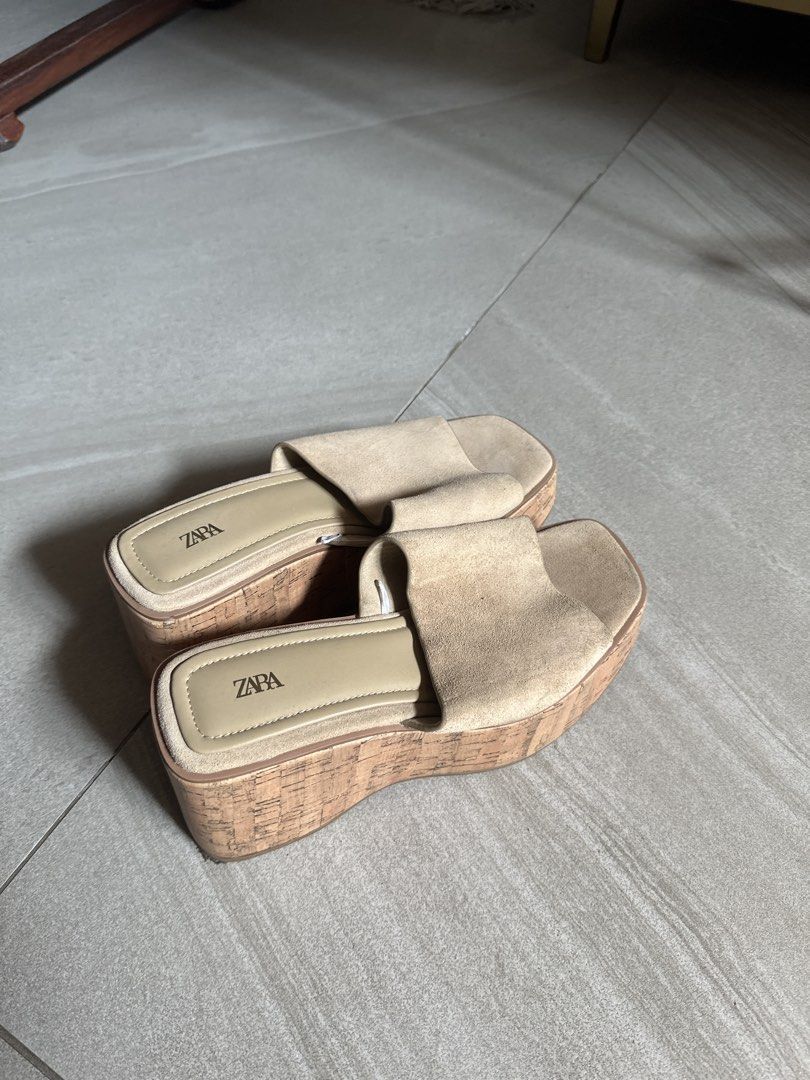 Zara Beige Suede Cork Wedge Sandals (Category: Wedges) located in Muntinlupa City. Submitted by stuffbya (Listing ID 1464972442, Image 1). Description: - Brand: Zara - Style: Platform sandals with chunky cork wedges - Material: Wide suede toe straps - Design: Easy slip-on style - Color: Versatile neutral beige - Features: Good heel height, stable to walk in, clean insoles with clear branding.