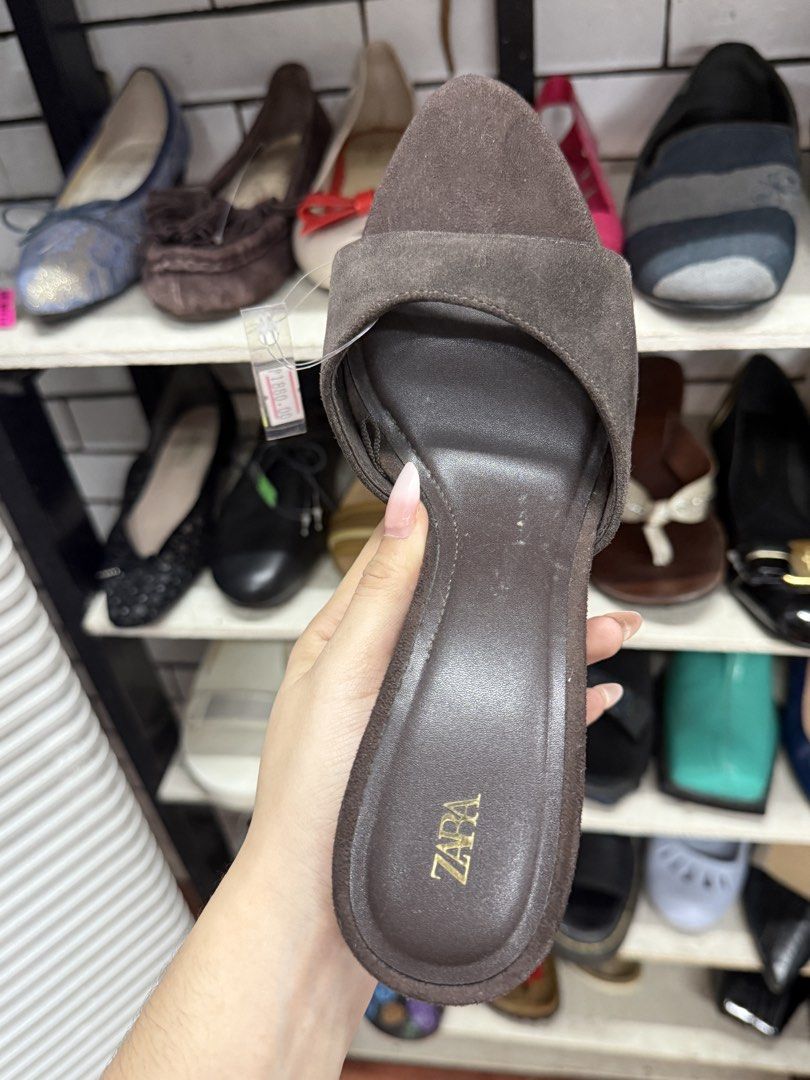 Zara Brown Suede Heels Size 38 (Category: Heels) located in Manila. Submitted by fastlion.584bdf (Listing ID 1465067589, Image 2). Description: - Brand: Zara - Style: Open toe slip-on heels with a slim heel - Material: Brown suede - Size: EU 38 - Condition: Good, with clear branding on the footbed and outer sole.