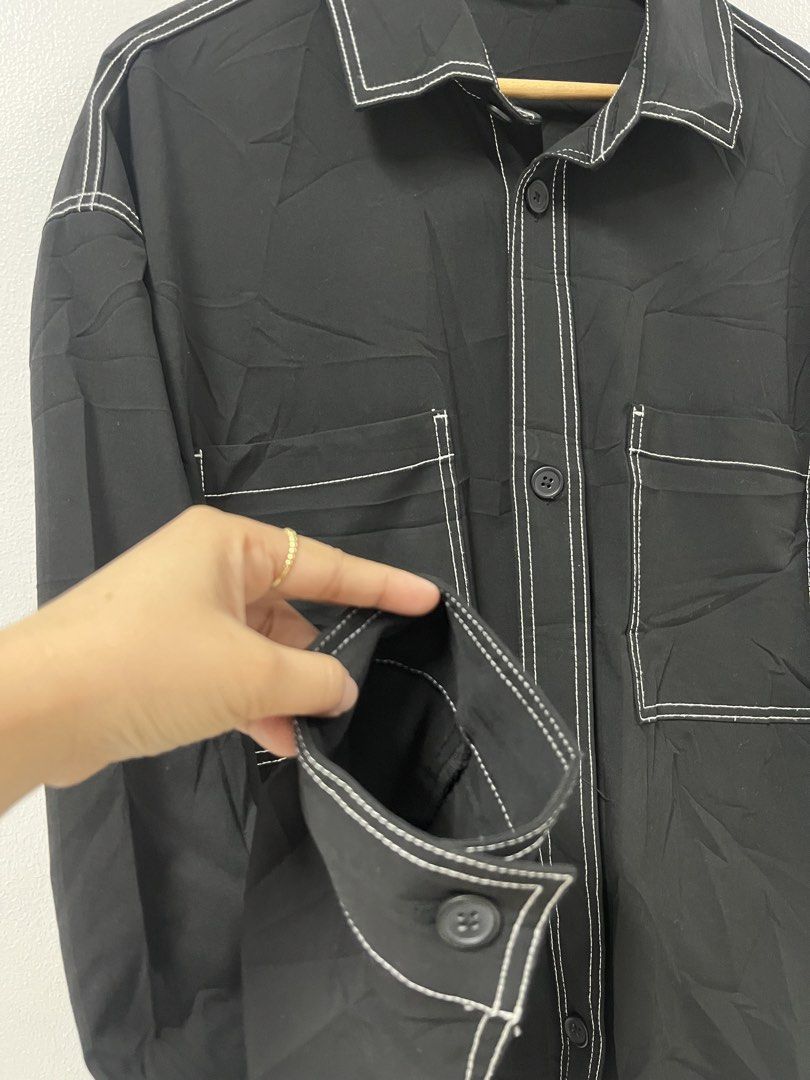 Zara Contrast Stitch Black Oversized (Category: Shirts) located in Angeles City. Submitted by donita_camorongan (Listing ID 1465058446, Image 3). Description: - Brand: Zara - Size: L - Color: Black with striking white contrast stitching - Fit: Relaxed oversized fit - Details: Camp collar, dual chest patch pockets, and button cuffs - Styling: Versatile minimal look, great worn solo or open over a tee Mop: Gcash | BDO Loc. Pampanga .