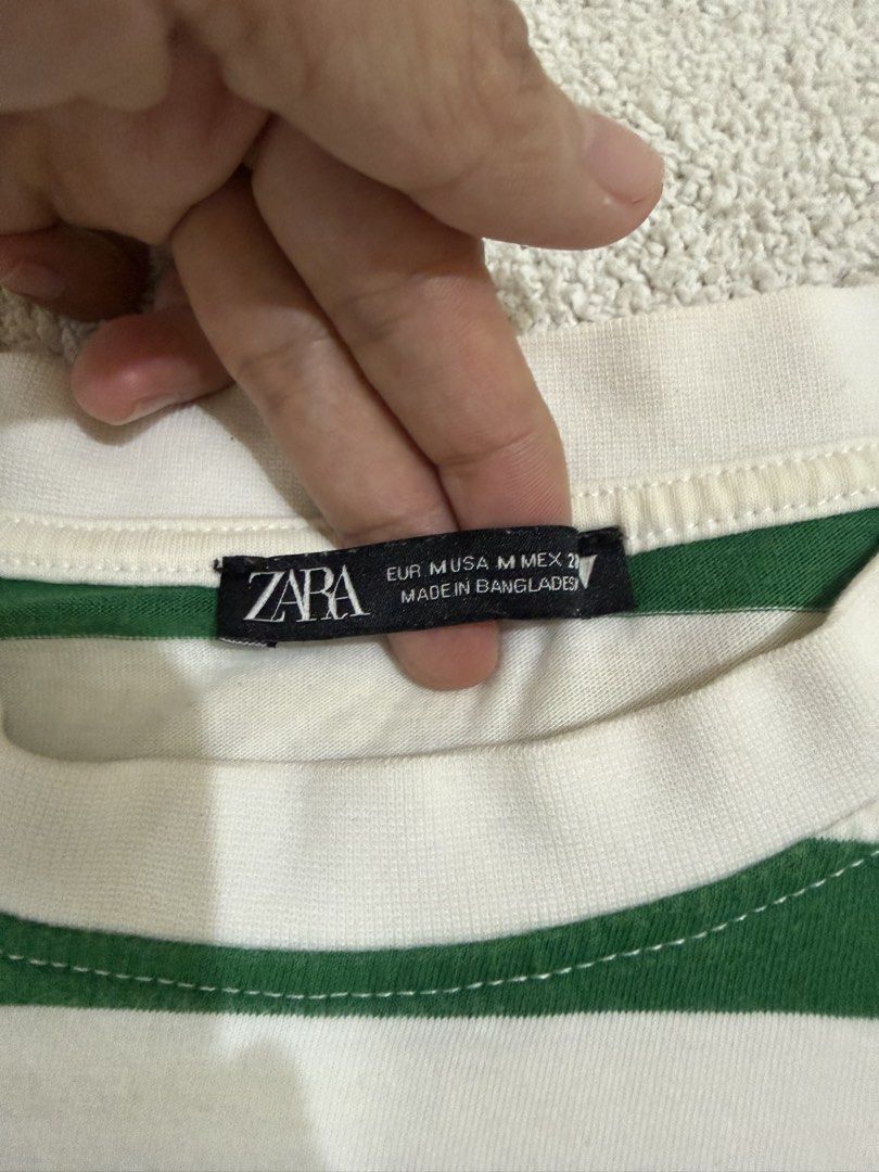 Zara Crop Top M (Category: Shirts) located in Subic. Submitted by kittysclosetsale (Listing ID 1465031335, Image 3). Description: - Brand: Zara - Style: Green & white horizontal stripes, short sleeves, crew neck crop top - Size: M (fits true to size) - Material: Soft, comfortable cotton - Condition: Worn a handful of times, clean and well-maintained - Perfect for: Casual everyday wear, easy to match with high-waisted jeans or shorts.
