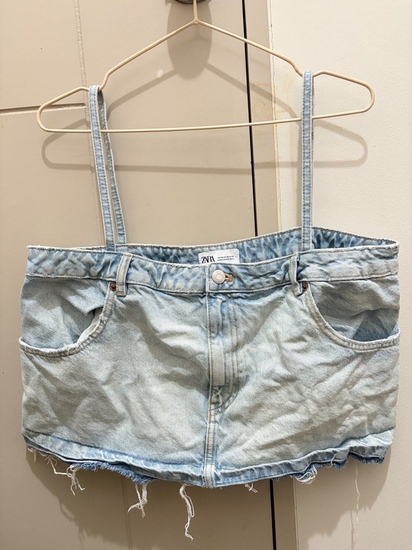 Zara Denim Top (Category: Sleeveless) located in Manila. Submitted by iluvbiscoffcookie (Listing ID 1465007822, Image 2). Description: - Brand: Zara - Style: Denim corset top with thin straps and raw frayed hem - Design details: Light wash blue, inverted waistband look with functional pockets and button fly at the top - Size: EUR XL, USA XL, MEX 32 - Origin: Made in Bangladesh - Versatile: Super trendy piece, easy to pair with high-waisted jeans 
