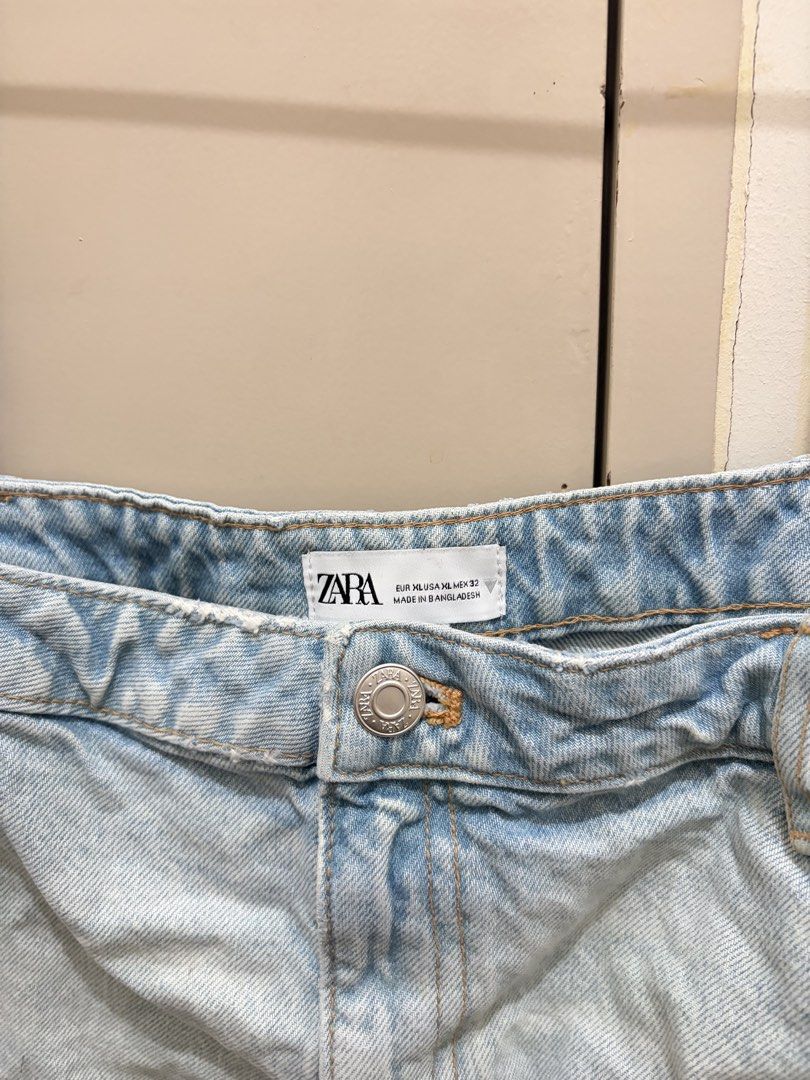 Zara Denim Top (Category: Sleeveless) located in Manila. Submitted by iluvbiscoffcookie (Listing ID 1465007822, Image 3). Description: - Brand: Zara - Style: Denim corset top with thin straps and raw frayed hem - Design details: Light wash blue, inverted waistband look with functional pockets and button fly at the top - Size: EUR XL, USA XL, MEX 32 - Origin: Made in Bangladesh - Versatile: Super trendy piece, easy to pair with high-waisted jeans 