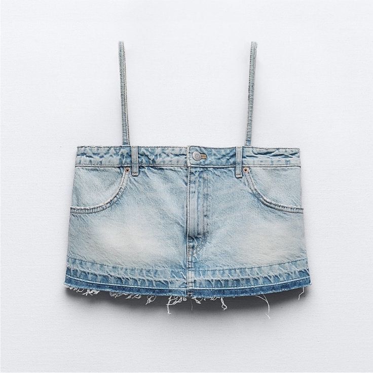 Zara Denim Top (Category: Sleeveless) located in Manila. Submitted by iluvbiscoffcookie (Listing ID 1465007822, Image 1). Description: - Brand: Zara - Style: Denim corset top with thin straps and raw frayed hem - Design details: Light wash blue, inverted waistband look with functional pockets and button fly at the top - Size: EUR XL, USA XL, MEX 32 - Origin: Made in Bangladesh - Versatile: Super trendy piece, easy to pair with high-waisted jeans 