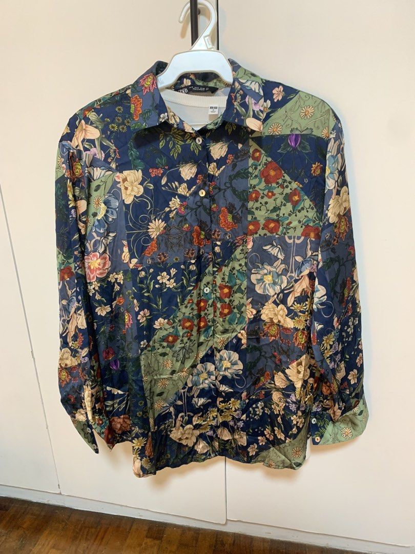 Zara Floral Patchwork Shirt Size S (Category: Blouses) located in Pasig City. Submitted by psiaaa (Listing ID 1465097362, Image 2). Description: - Brand: Zara - Style: Floral patchwork button-down shirt with classic collar and long sleeves - Color: Navy blue base with multi-colored green and floral printed patches - Size: S - Material: Lightweight fabric - Origin: Made in Morocco - Condition: Great statement piece for casual wear.