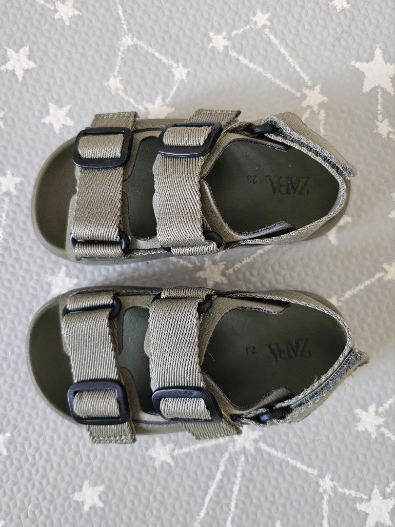Zara Kids Buckle Sandals (Category: Babies & Kids Fashion) located in Makati City. Submitted by camillamanila (Listing ID 1465029922, Image 2). Description: - Brand: Zara Kids - Color: Olive Green - Size: US 23 (printed inside sole) - Features: Double front straps with plastic buckles, adjustable ankle hook-and-loop closure, and a soft moulded footbed - Condition: Clean and hardly worn - RFS: size too small for my son.