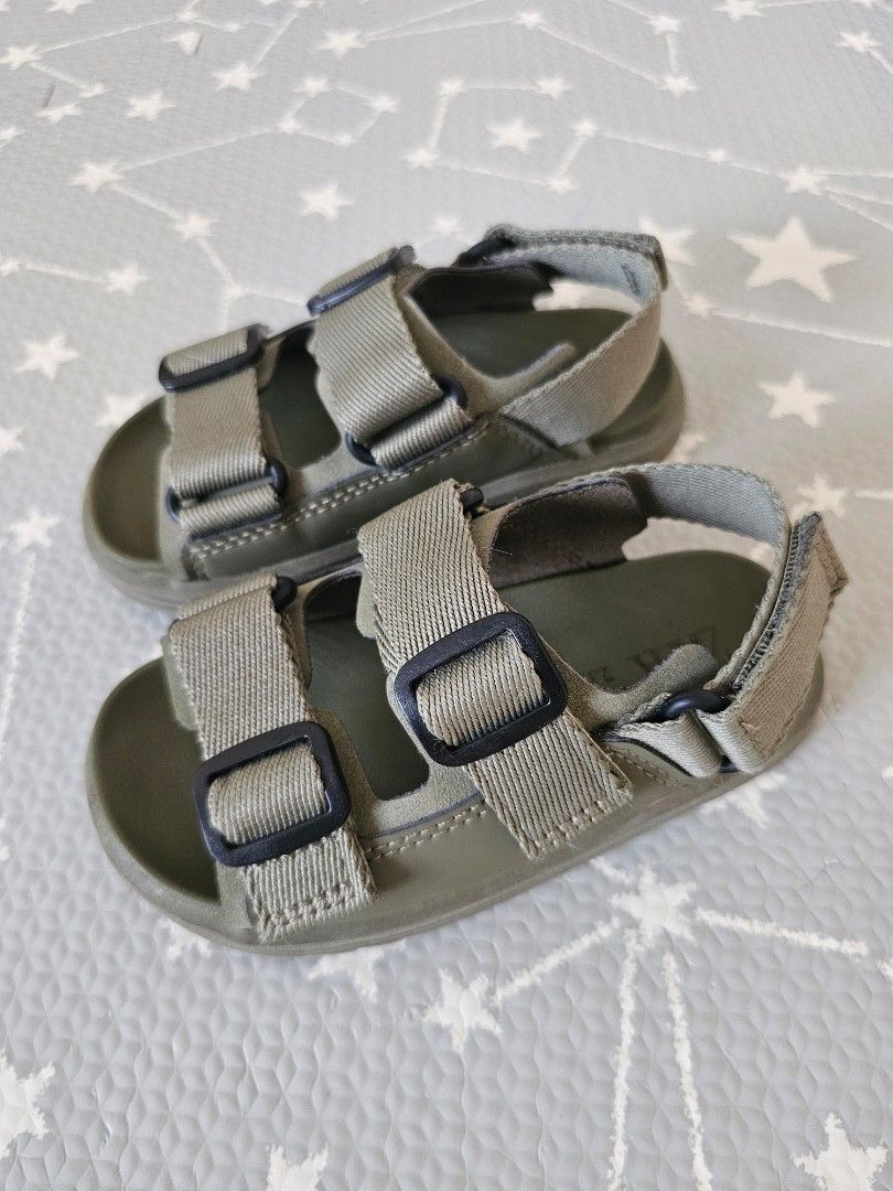 Zara Kids Buckle Sandals (Category: Babies & Kids Fashion) located in Makati City. Submitted by camillamanila (Listing ID 1465029922, Image 1). Description: - Brand: Zara Kids - Color: Olive Green - Size: US 23 (printed inside sole) - Features: Double front straps with plastic buckles, adjustable ankle hook-and-loop closure, and a soft moulded footbed - Condition: Clean and hardly worn - RFS: size too small for my son.