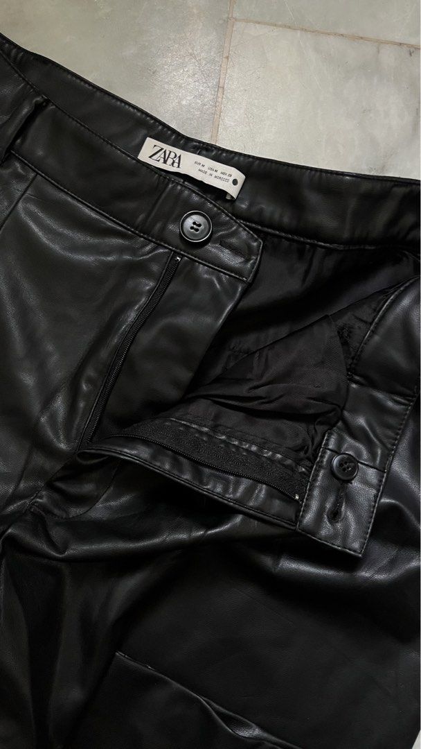 Zara Leather Trousers Black Size M (Category: Jeans) located in Marikina City. Submitted by thealexaclub.clo (Listing ID 1465002536, Image 2). Description: - Brand: Zara - Size: Medium (M) - Color: Classic Brown - Material: Smooth faux leather (Clean finish) - Origin: Made in Morocco - Closure: Button closure with zipper fly - Design: Stylish pleated front - Condition: Excellent - Versatile: Great for casual day wear or a night out!.