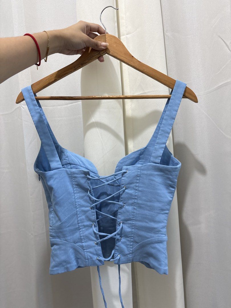 ZARA Light Blue Corset Top XS (Category: Sleeveless) located in Quezon City. Submitted by ch4se (Listing ID 1465018162, Image 2). Description: - used once only - has boning on the front - tie up at the back rfs: does not compliment my skintone.
