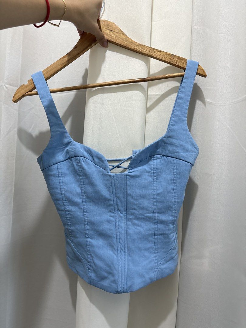 ZARA Light Blue Corset Top XS (Category: Sleeveless) located in Quezon City. Submitted by ch4se (Listing ID 1465018162, Image 1). Description: - used once only - has boning on the front - tie up at the back rfs: does not compliment my skintone.