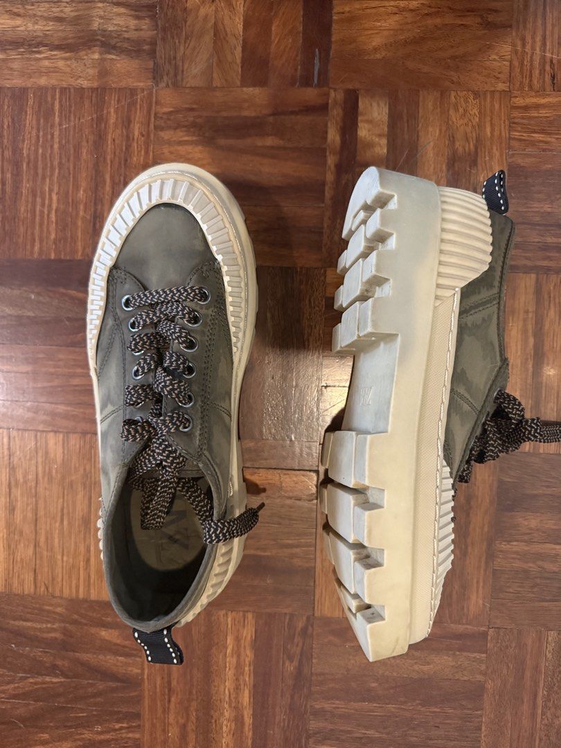 Zara Olive Green Lug Sole Platform Sneakers (Category: Sneakers) located in Manila. Submitted by andromedanny (Listing ID 1465005911, Image 2). Description: - Brand: Zara, Size 7 - Color: Olive green upper with cream, brown, and black details - Sole: Thick cream platform with deep treads for extra grip - Laces: Unique brown and black patterned laces - Features: Convenient back pull tab, branded insole stamp - Condition: Clean with minimal wear on