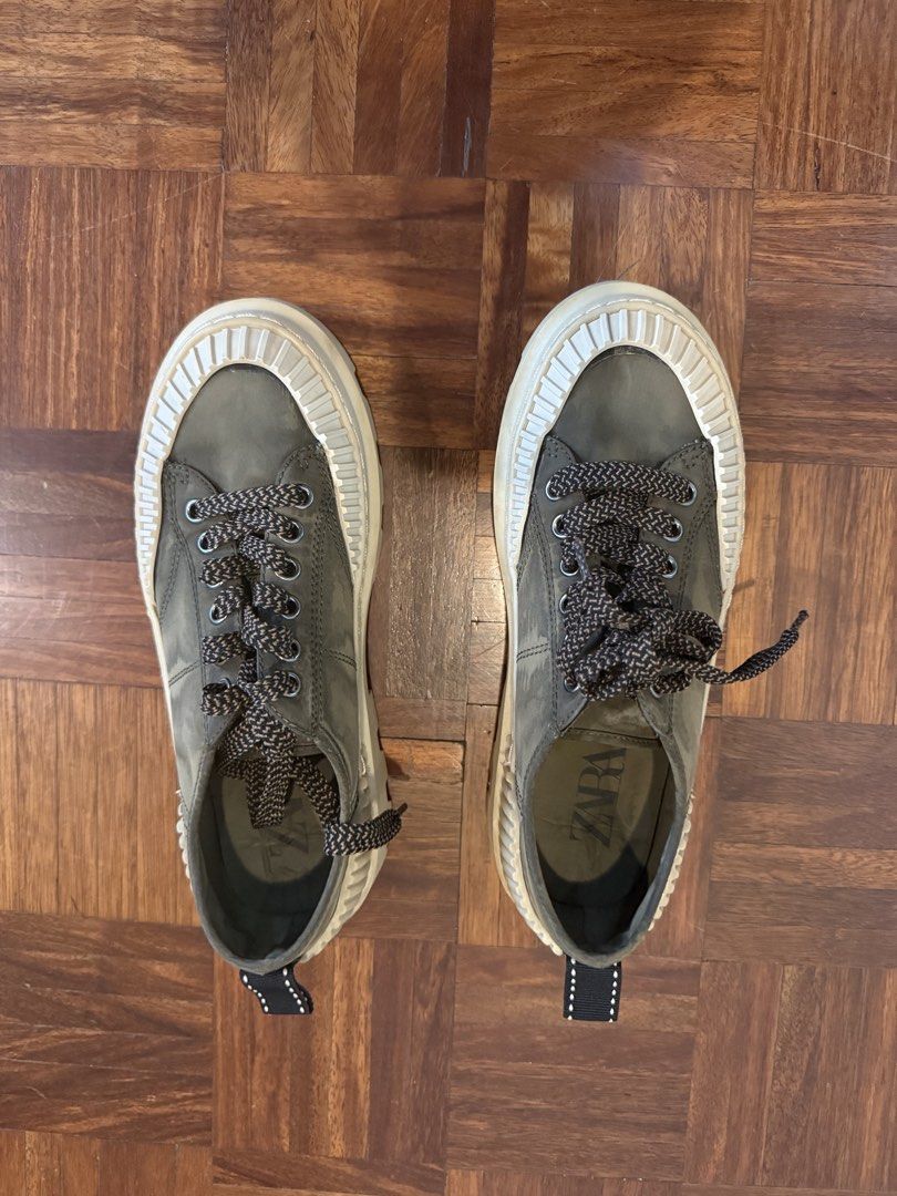 Zara Olive Green Lug Sole Platform Sneakers (Category: Sneakers) located in Manila. Submitted by andromedanny (Listing ID 1465005911, Image 1). Description: - Brand: Zara, Size 7 - Color: Olive green upper with cream, brown, and black details - Sole: Thick cream platform with deep treads for extra grip - Laces: Unique brown and black patterned laces - Features: Convenient back pull tab, branded insole stamp - Condition: Clean with minimal wear on