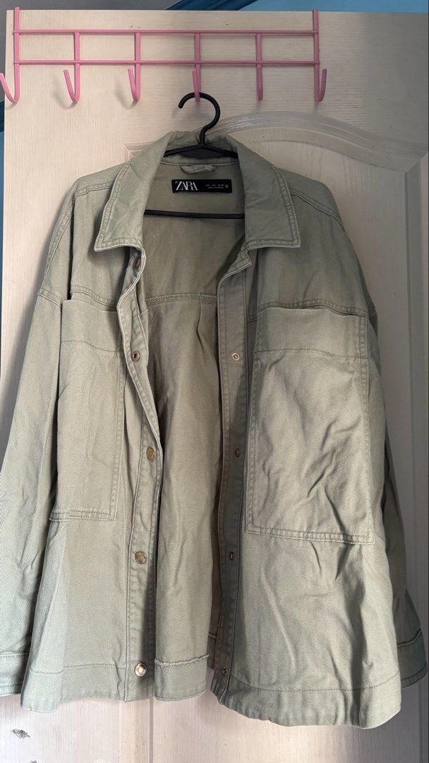 Zara Olive Green Oversized Denim Jacket (Category: Coats, Jackets and Outerwear) located in Las Pinas. Submitted by badudisparku (Listing ID 1465020885, Image 1). Description: - Brand: Zara (Ukay find) - Color: Olive green - Size: L (Oversized fit) - Material: Sturdy denim, made in Cambodia - Features: Front button closures and dual chest pockets Can do meetups at Southmall/Pilar area and Uptown BGC..