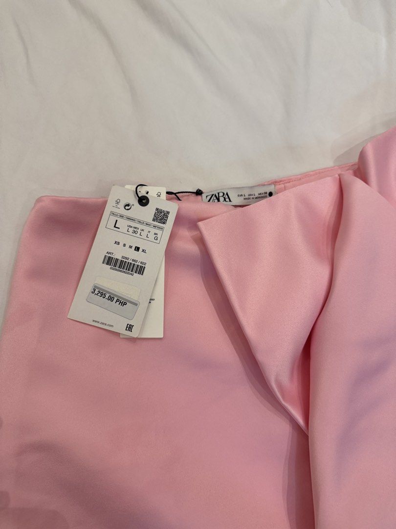 ZARA Pink Satin Mini Skirt with Bow Drape (Category: Skirts) located in Quezon City. Submitted by declutteringmycloset__ (Listing ID 1464981951, Image 2). Description: - Brand new, never worn - Original tags attached - Original Price: 3,295 PHP - High waist mini skirt .