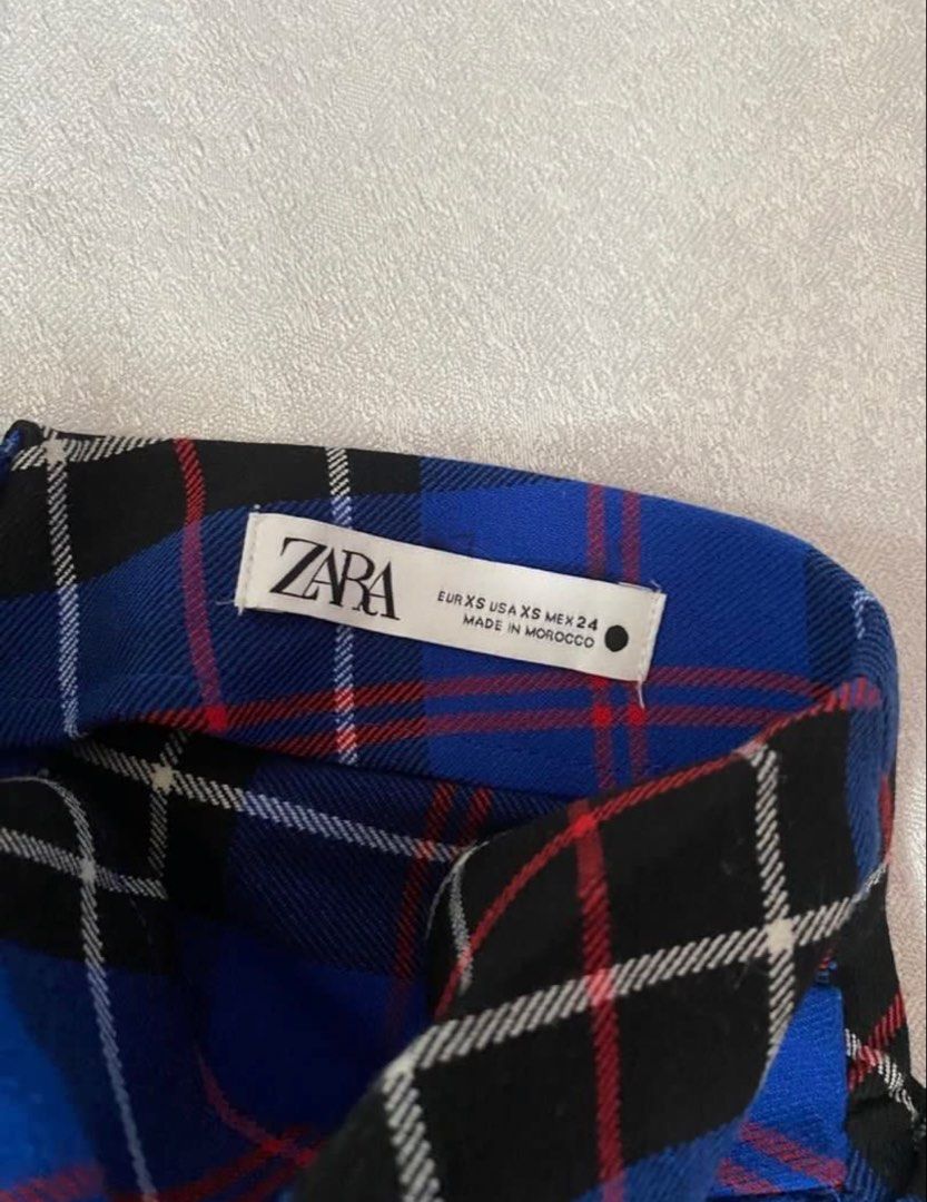 Zara Plaid Skirt With Slit (Category: Skirts) located in Pasig City. Submitted by abibilitinda (Listing ID 1464991035, Image 2). Description: - Brand: Zara - Style: Blue and black tartan plaid maxi skirt - Size: XS (Waist: 25", Length: 34.5") - Details: High waist, gathered side detail, chic front slit - rfs: declutter.
