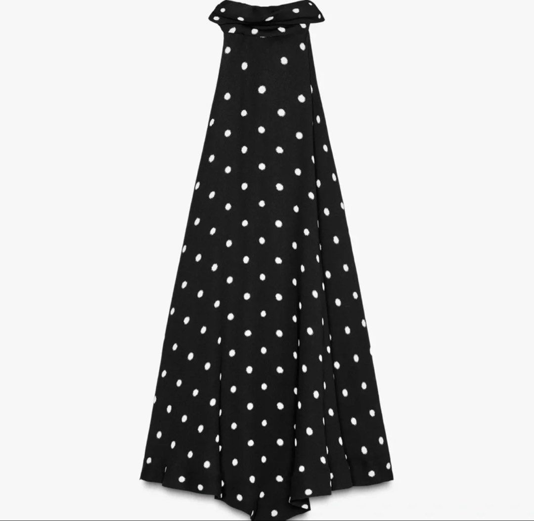 Zara Polka Dot Open Back Halter Top (Category: Sleeveless) located in Manila. Submitted by iluvbiscoffcookie (Listing ID 1465006958, Image 3). Description: - Style: Halter top with high neck and open back - Pattern: Classic white polka dots on black - Details: Cute side string ties, lightweight and flowy fabric - Condition: Brand new with tags (BNWT), never worn - Size: Fits Medium to Large (M-L).