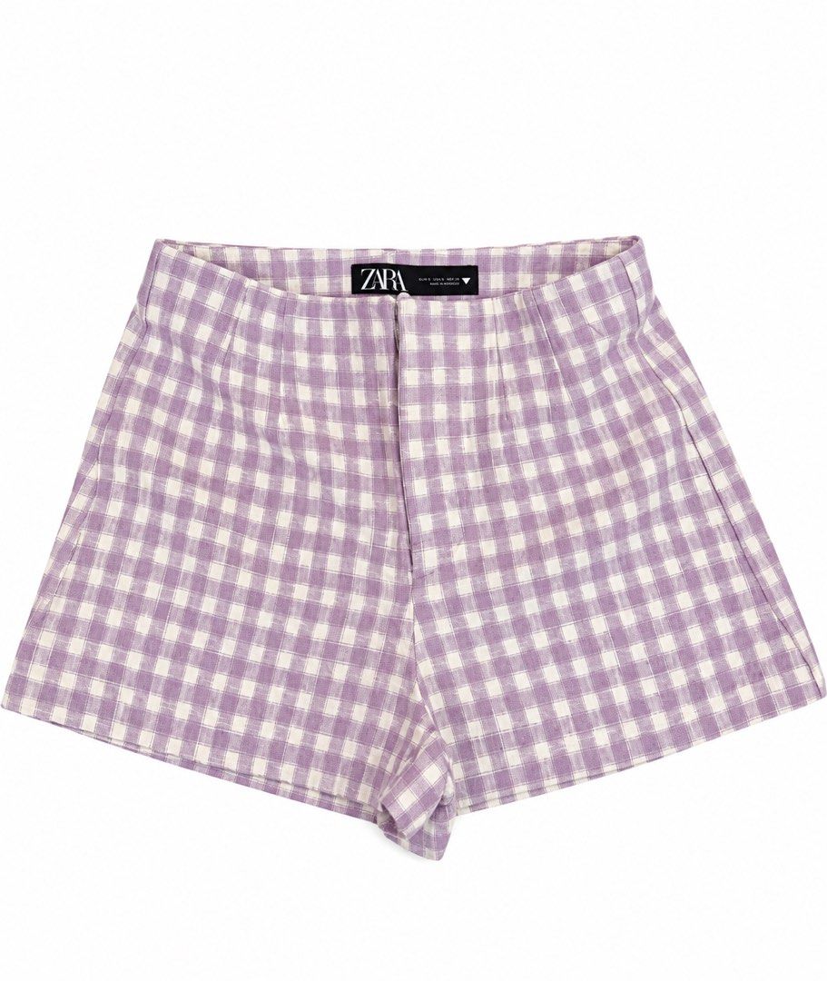 Zara Purple Gingham Checkered Shorts Size S (Category: Shorts) located in Manila. Submitted by odd.plzbuymyclothess (Listing ID 1465111138, Image 1). Description: - Brand: Zara - Size: XS (tag attached) - Pattern: Light purple & white gingham - Fit: High-waisted with structured darting - Closure: Back zipper with clean front design - Fabric: Lightweight.