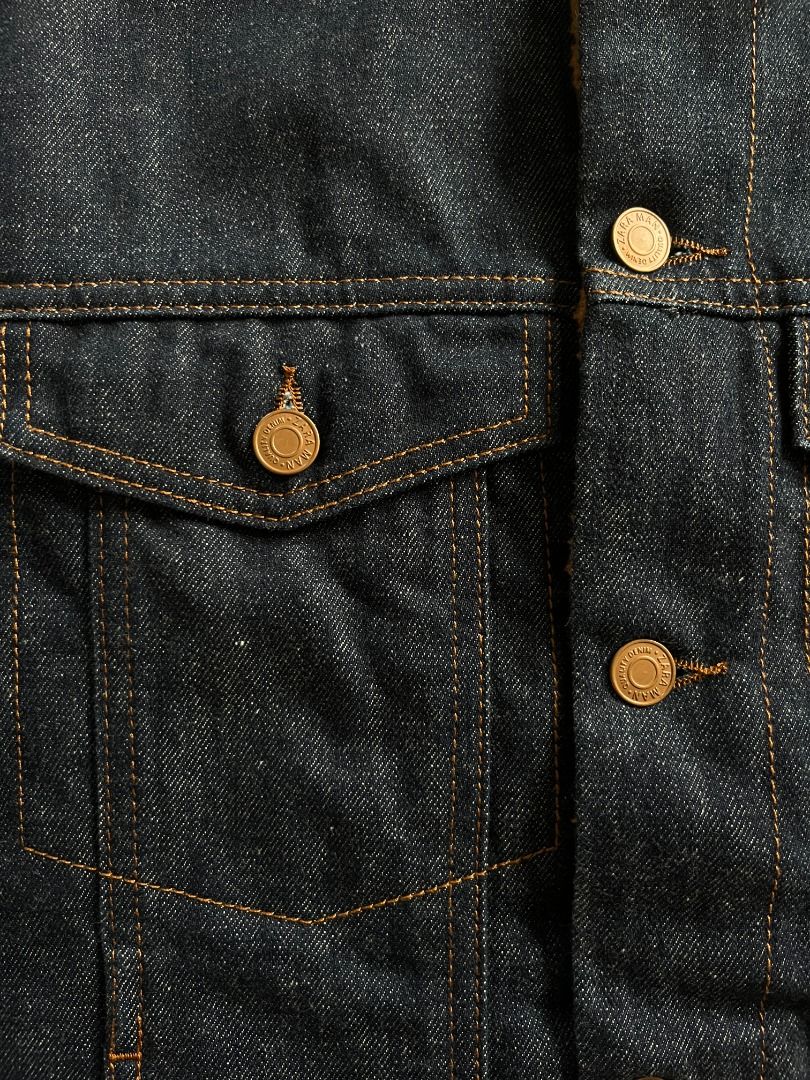 Zara Sherpa-Lined Denim Jacket (Category: Coats, Jackets and Outerwear) located in Lipa City. Submitted by thesecondrackph (Listing ID 1465019469, Image 3). Description: - Brand: Zara - Style: Denim jacket with sherpa fleece lining - Color: Dark blue denim with warm brown collar/lining - Size: XL (fits true to size) - Length: 26" x Width: 22" - Closure: Classic button-up front with metal buttons - Pockets: Two chest flap pockets and two lower sid