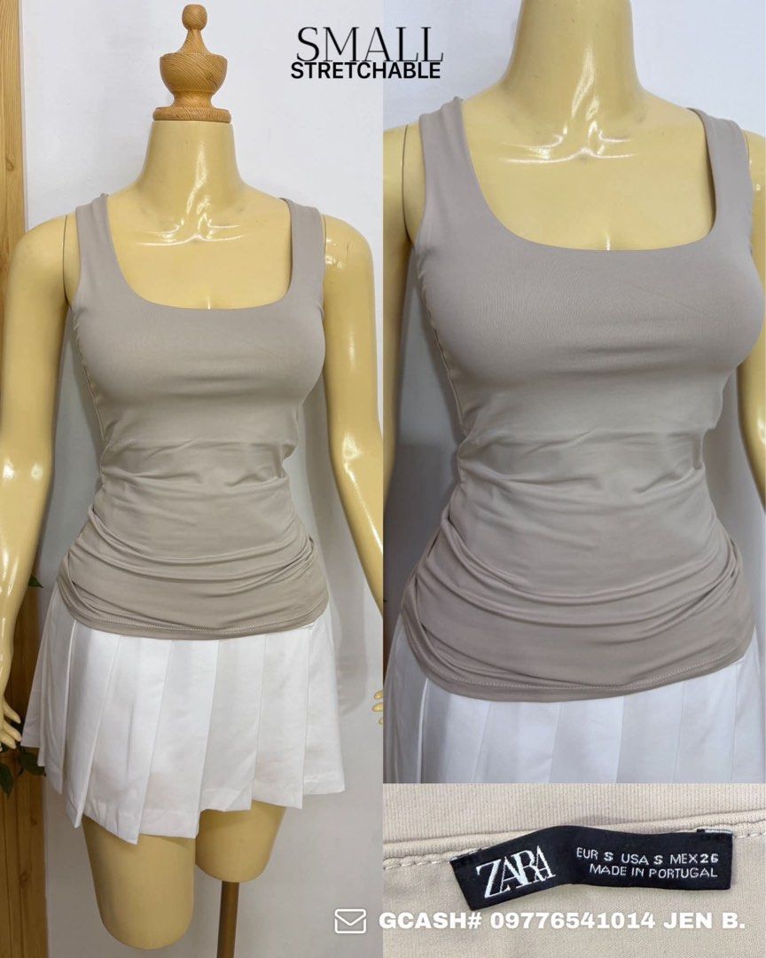 ZARA Stretchable Beige Tank Top Size S (Category: Sleeveless) located in Tagum. Submitted by bernardino49694 (Listing ID 1465077073, Image 1). Description: - Brand: ZARA - Color: Beige - Size: S (Made in Portugal) - Material: Ribbed stretch fabric - Design: Scoop neckline, wide straps, hip-length - Condition: Clean interior tag attached - Styling: Easy to match with skirts or jeans.