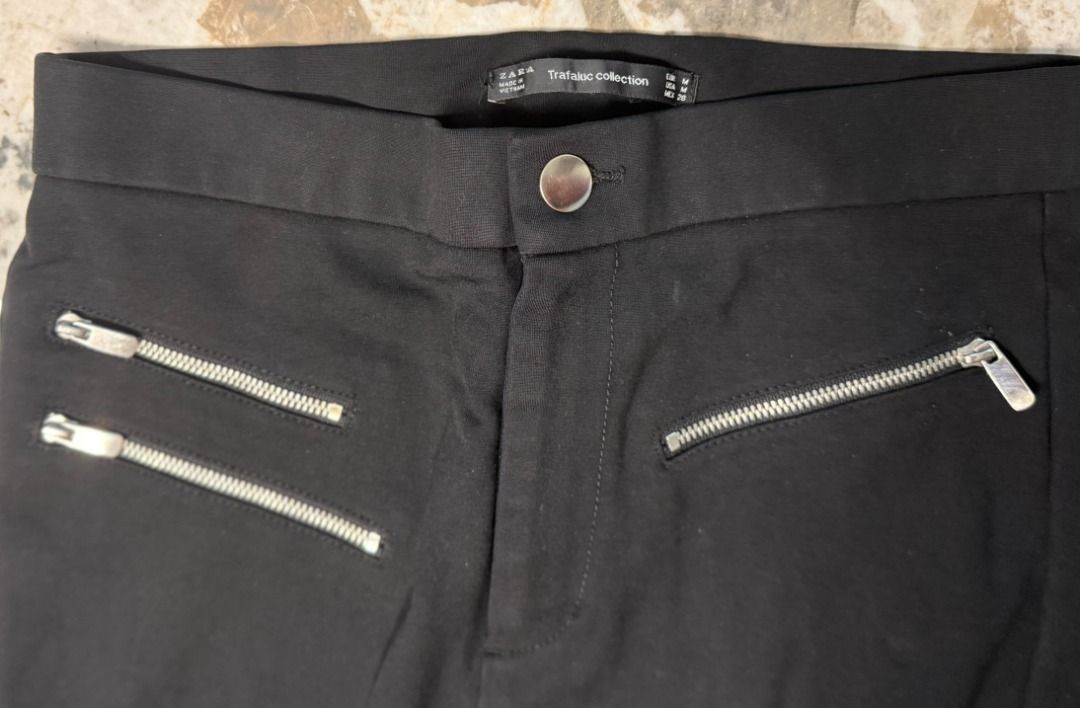 ZARA TRF ASYMMETRIC MULTI-ZIP BIKER PANTS (Category: Jeans) located in Makati City. Submitted by fpled (Listing ID 1464727427, Image 2). Description: ✨ ZARA TRF ASYMMETRIC MULTI-ZIP BIKER PANTS ✨ • Size US 6 (Fits 27” to 29” Waist) • Asymmetric Silver Hardware • Downtown Girl / Cyber Y2K Zara Trafaluc! Crafted from a thick, structured stretch fabric that holds its shape and flatters your figure. Features edgy asymmetric exposed silver zippers acr