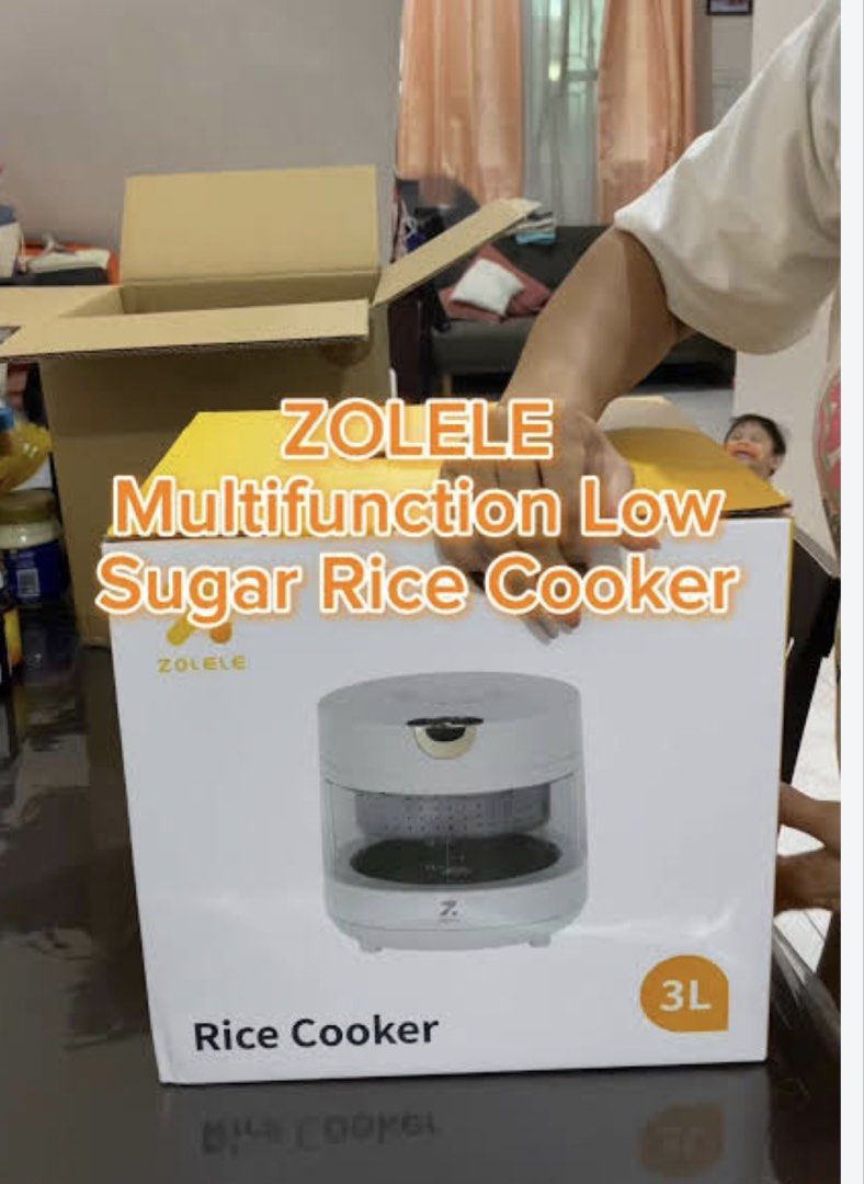 Zolele Multifunction Low Sugar Rice Cooker 3L (Category: Cookers) located in Manila. Submitted by kisshadg23 (Listing ID 1465123559, Image 2). Description: - Brand: Zolele Low Sugar Rice Cooker - Capacity: 3-Liter - Color/Design: Modern round white body with clear viewing window - Condition: Powers on and heats properly - Inclusions: Original box packaging included - Features: Healthier meal prep & easy-to-clean parts.