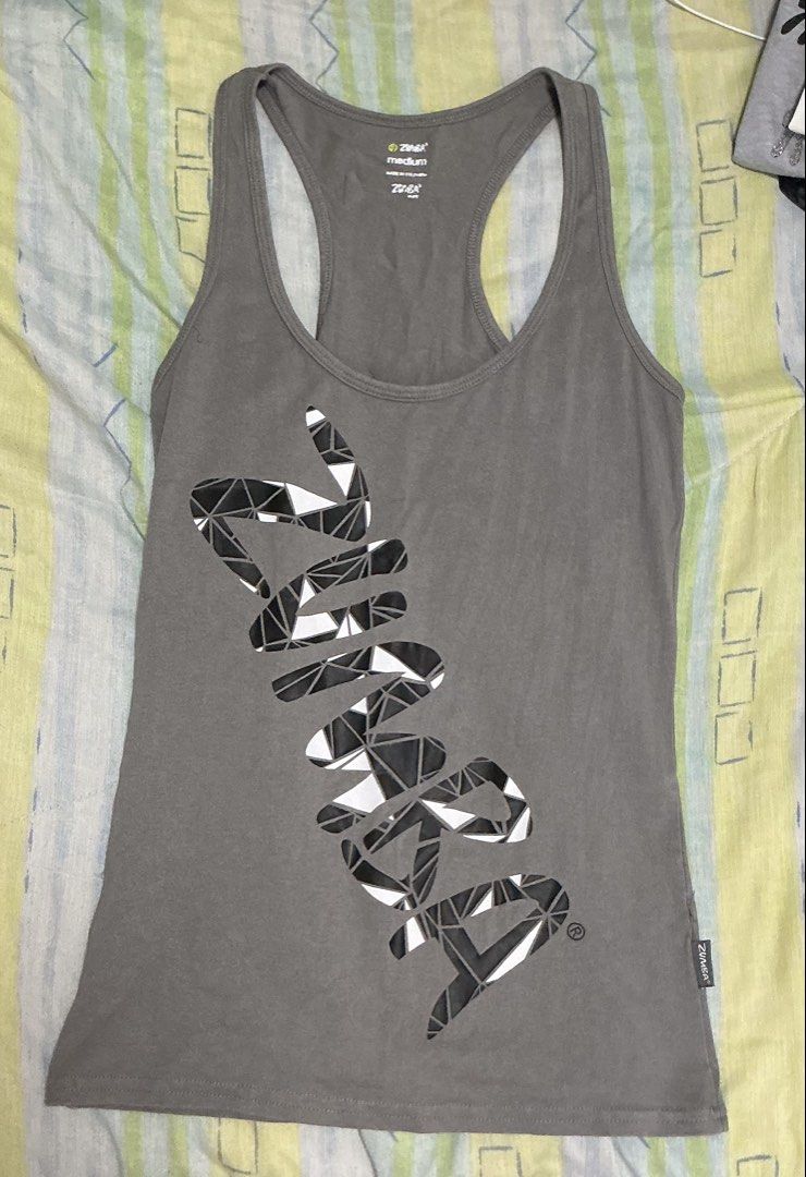 Zumba Grey Racerback Tank Top Medium (Category: Activewear) located in Manila. Submitted by mornight736 (Listing ID 1465007738, Image 1). Description: - Size: Medium - Ideal for: Zumba, dance classes, workout sessions, or casual gym wear - Care & Pairing: Easy to wash; pairs well with leggings or shorts - MOP: Gcash + SF - SF is shouldered by buyer .