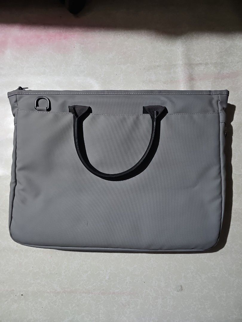 16' Grey Laptop Bag with Orange Interior (Category: Laptop Bags & Sleeves) located in Bulacan. Submitted by swansverse (Listing ID 1459656915, Image 2). Description: - Can fit 16" laptop - Stylish grey laptop bag with a vibrant orange interior. - Main zippered compartment for secure storage. - Additional front zippered pocket for quick access items. - Small front pouch for extra organization. - Comfortable handles for easy carrying. - Perfect for