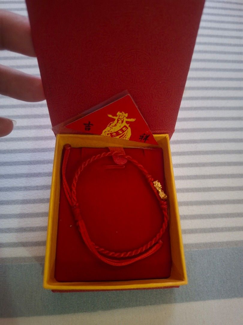 18K Gold Pixiu Bracelet with Red String (Category: Bracelets) located in Rodriguez. Submitted by jsfashionolshop (Listing ID 1459500213, Image 2). Description: - Authentic 18K Gold Pixiu Bracelet - Comes with Red String for Good Luck - Includes Original Box - Includes Authenticity Card - Pixiu believed to attract wealth and offer protection - Perfect for gifting or personal use - Sold as a complete set.