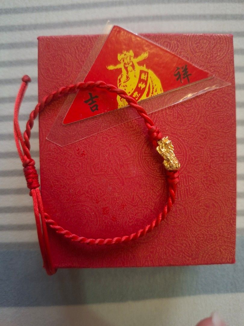 18K Gold Pixiu Bracelet with Red String (Category: Bracelets) located in Rodriguez. Submitted by jsfashionolshop (Listing ID 1459500213, Image 3). Description: - Authentic 18K Gold Pixiu Bracelet - Comes with Red String for Good Luck - Includes Original Box - Includes Authenticity Card - Pixiu believed to attract wealth and offer protection - Perfect for gifting or personal use - Sold as a complete set.