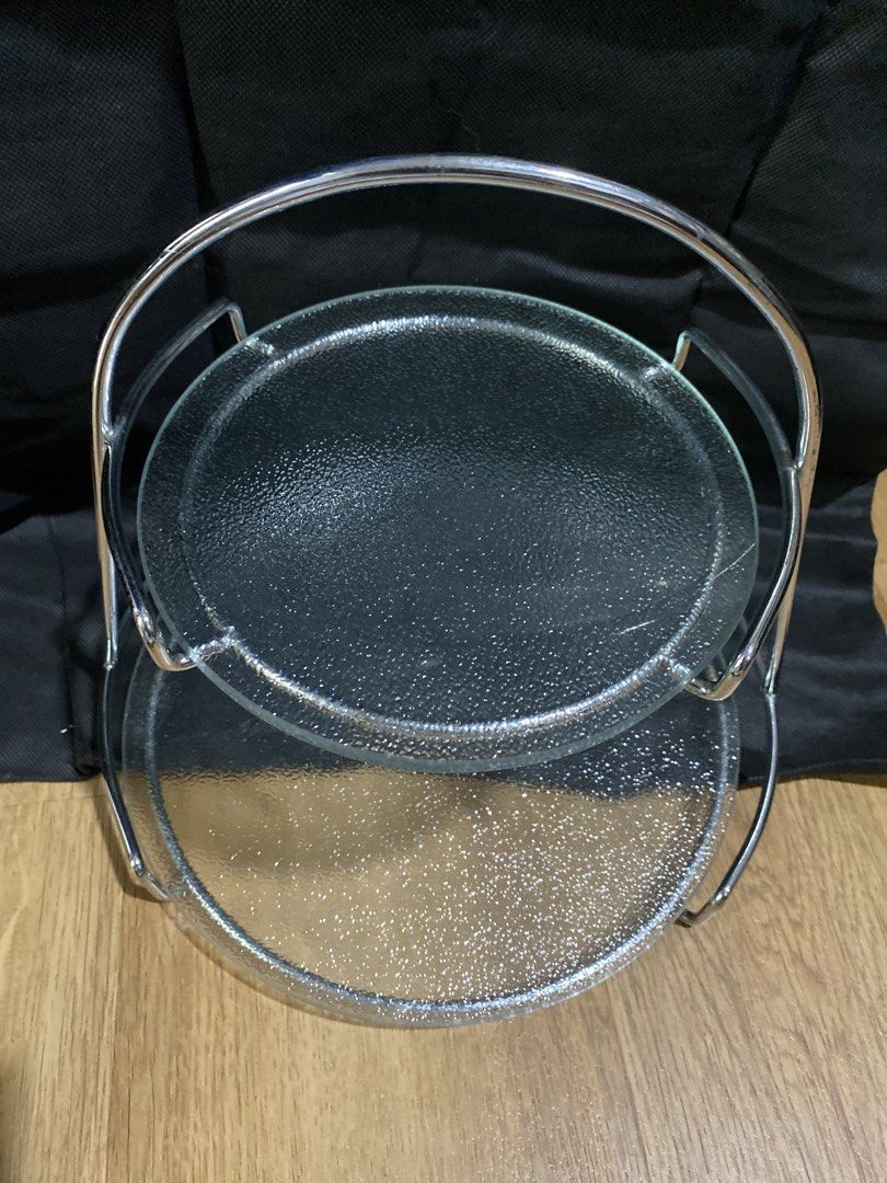 2 Tier Glass Serving Stand with Metal Handle (Category: Other Kitchenware & Tableware) located in Taguig. Submitted by cosmickindle (Listing ID 1459568874, Image 1). Description: - Two-tier serving stand - Clear textured glass plates - Shiny chrome metal frame and handle - Ideal for desserts, appetizers, and snacks - Great for parties, everyday use, or special occasions - Easy to carry - Slightly negotiable - RFS: Not in use **First to pay gets i