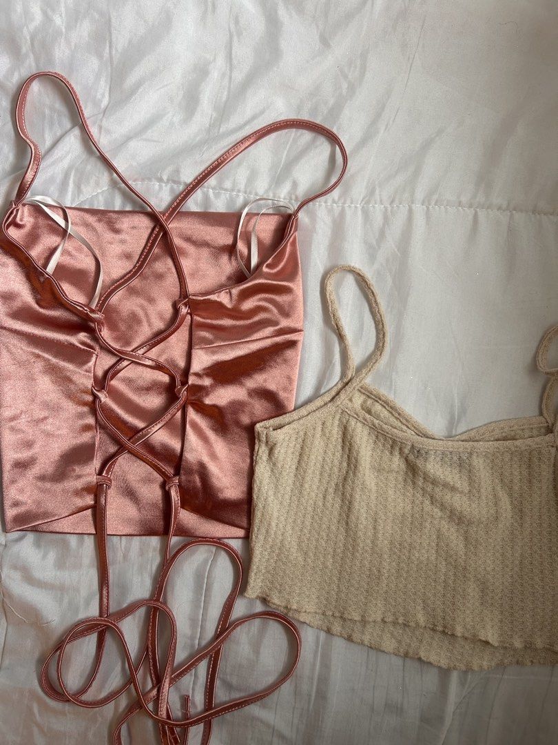 2x Crop Tops - Satin & Ribbed (Category: Blouses) located in Kawit. Submitted by grandbear.a8d19e (Listing ID 1459555890, Image 2). Description: Selling two cute crop tops. One is a silky pink cami with a lace-up back. The other is a beige ribbed tank top with a ruched front. Both are cropped length. .