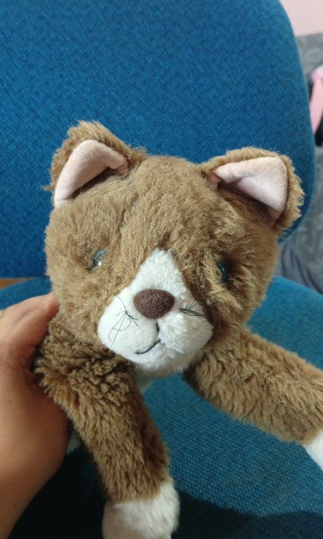 38cm dark brown lying realistic cat stuffedtoys (Category: Plushies & Soft Toys) located in Echague. Submitted by manikaisabelavarietyshop (Listing ID 1459611982, Image 2). Description: 38cm dark brown lying realistic cat stuffedtoys.