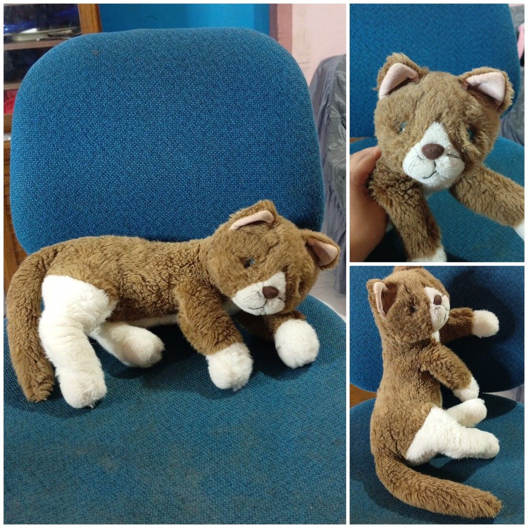 38cm dark brown lying realistic cat stuffedtoys (Category: Plushies & Soft Toys) located in Echague. Submitted by manikaisabelavarietyshop (Listing ID 1459611982, Image 1). Description: 38cm dark brown lying realistic cat stuffedtoys.