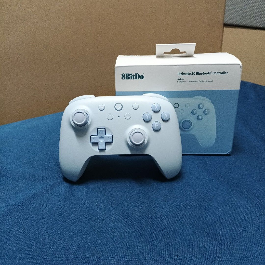 8BitDo Ultimate 2C Wireless Bluetooth Controller (Category: Controllers) located in Singapore. Submitted by cheeserat249 (Listing ID 1459633111, Image 1). Description: - 8BitDo Ultimate 2C Bluetooth Controller - Color: Light Blue - Compatibility: Nintendo Switch, PC, Android Phone and Tablet. - Includes: Controller, USB cable, Manual - Comes with original box - Ideal for portable and home gaming - This is the wireless version that does not use do