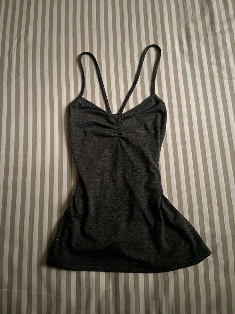 crossback grey tank top (xs) (Category: Blouses) located in Makati City. Submitted by louslyfits (Listing ID 1459569453, Image 1). Description: good condition used 3x xs-m stretchy fabric bpi qr code payment delivery by jrs or grab.