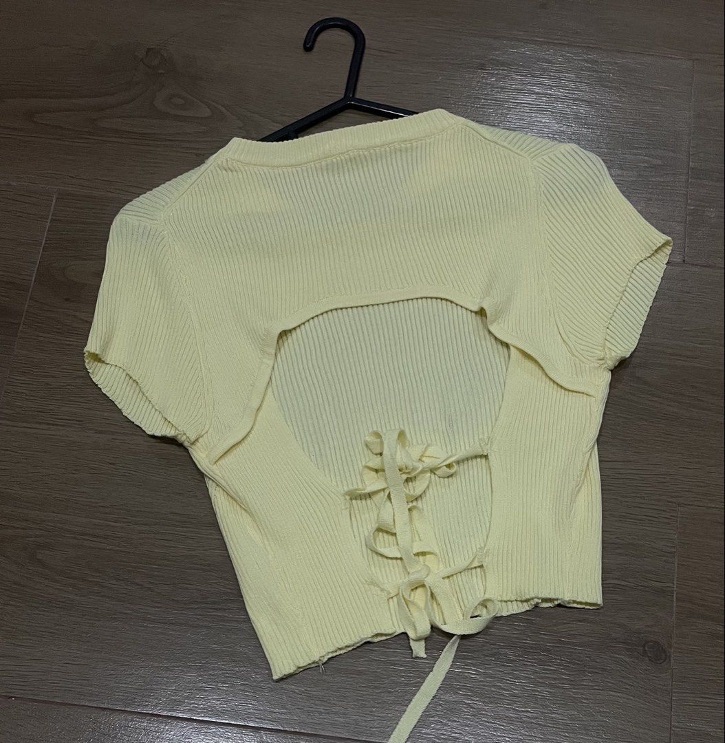 💛 Pastel Yellow Ribbed Open-Back Tie Top (Category: Blouses) located in Bulacan. Submitted by ladyjagged (Listing ID 1459626463, Image 2). Description: Fits xs to small No issue Preloved; washed and clean * Soft pastel/butter yellow * Ribbed knit texture * Open-back design * Adjustable lace-up/tie-back detail * Cropped/fitted style.