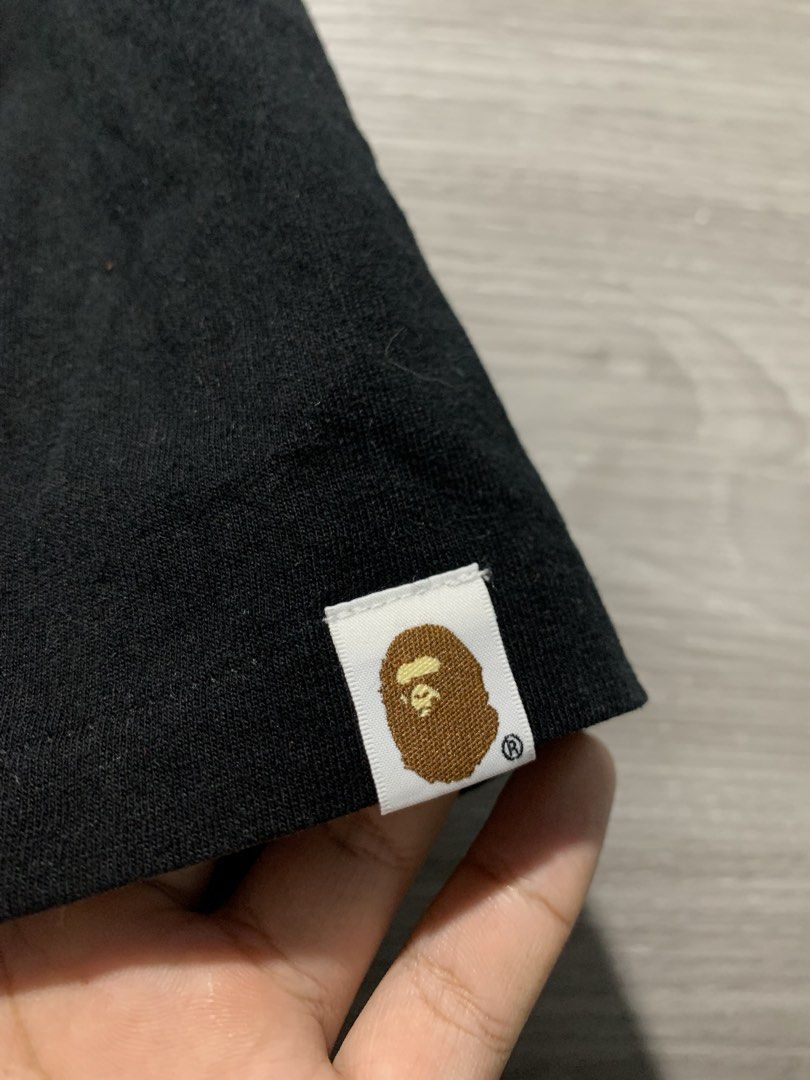 A Bathing Ape Shirt (Category: Activewear) located in San Jose. Submitted by vedaniaarv64346 (Listing ID 1459606356, Image 2). Description: 2XL Authentic glow in the dark design 9/10 color rate and condition minimal hairlines 1899 only .