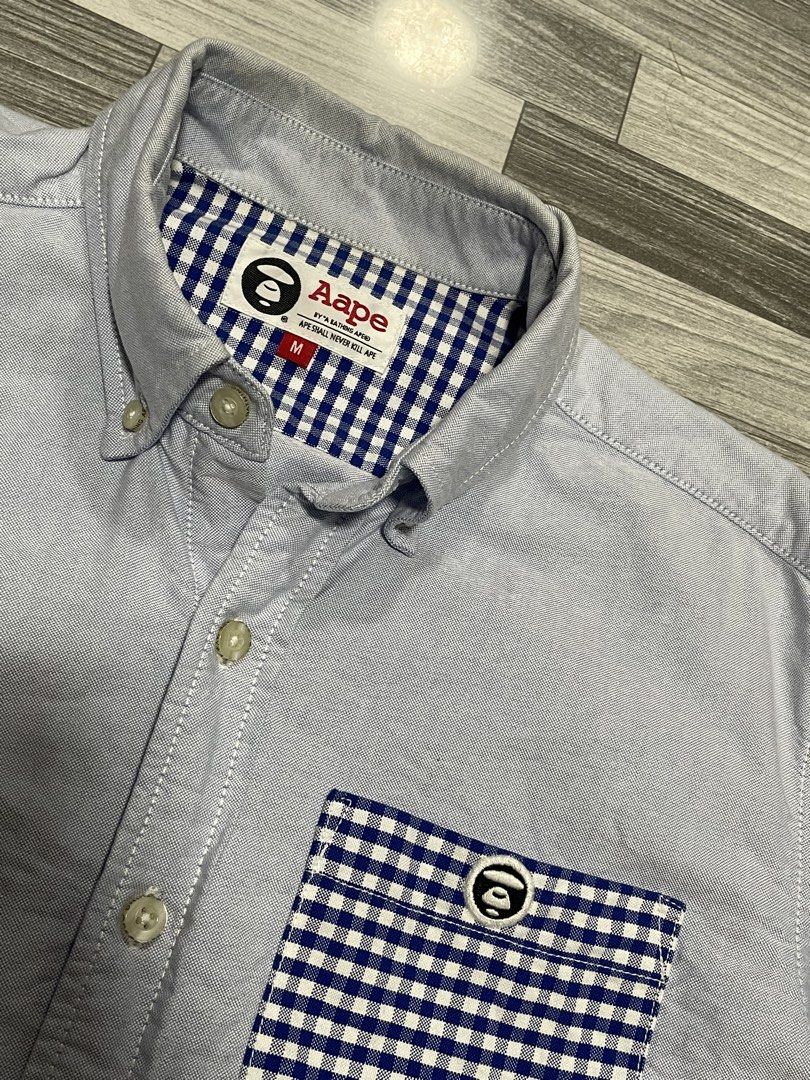 Aape Bathing Ape Polo Button down (Category: Activewear) located in Caloocan City. Submitted by thriftkidd2024 (Listing ID 1459649891, Image 2). Description: [ Aape Polo Button Down ] M on tag width: 19 length: 26.5 In excellent condition 9/10 color rate 850php Free shipping within Nationwide 🇵🇭 Plus Shipping fee in International 🌎 Taguig city, Metro Manila, PH 📍 DM TO PURCHASE 📥📥📥.